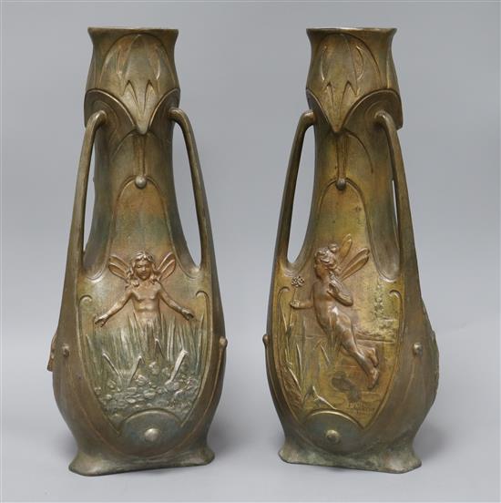 A pair of Art Nouveau bronzed vases signed J. Garnier Height 38cm